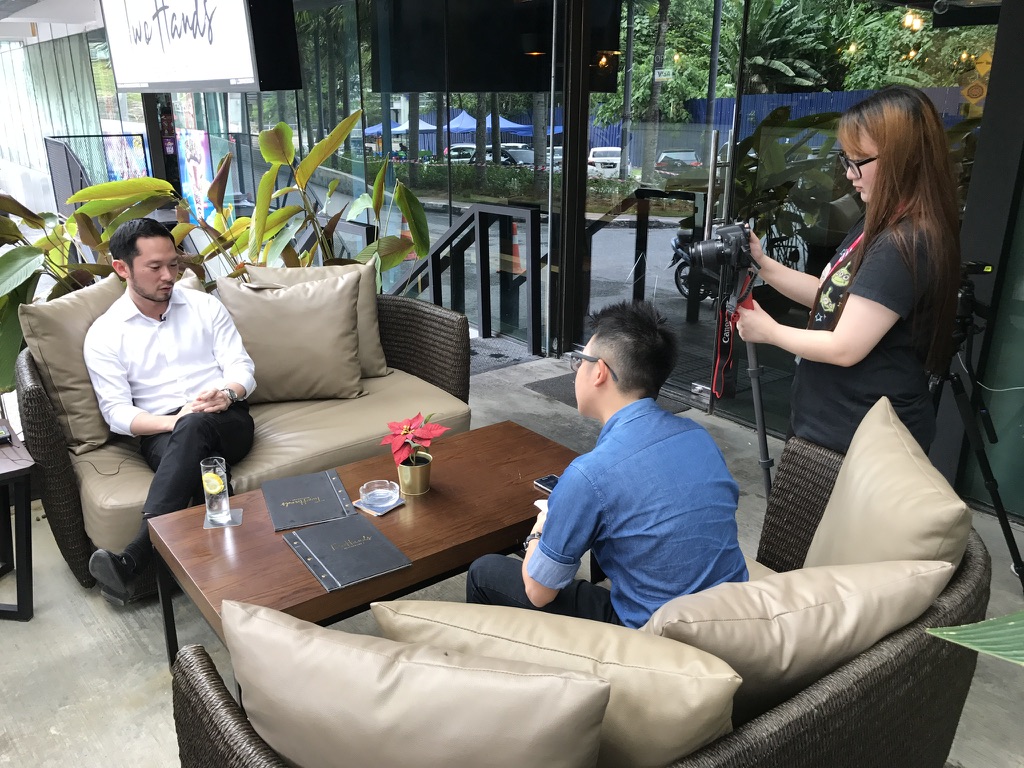 Chan Eu Boon – Interview at Two Hands Café - Chan Eu Boon (Darren) Chan Eu Boon in a media interview session at Two Hands Café with video crew and interviewer.