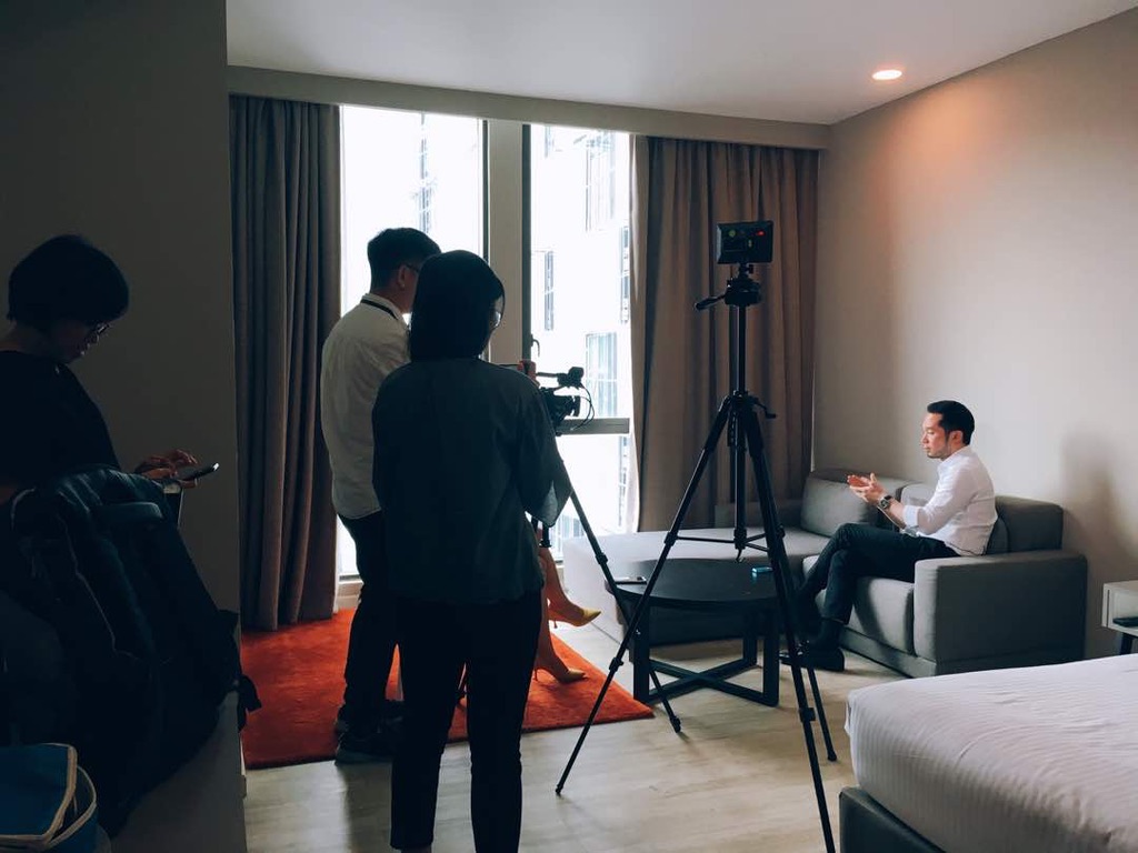 Behind-the-scenes photo of Chan Eu Boon in a filmed interview with full production crew.